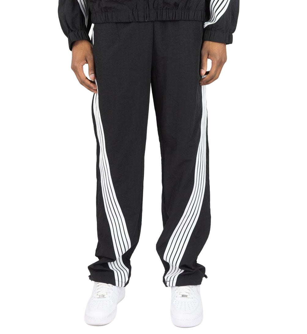 Black Rebel Minds Stripe Nylon Pants worn by a person on a white background