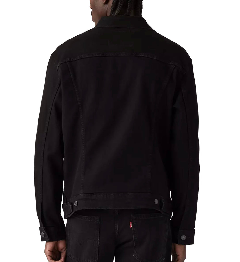 Person wearing a Levi’s Trucker Jacket — Last Night (Black) on a white background