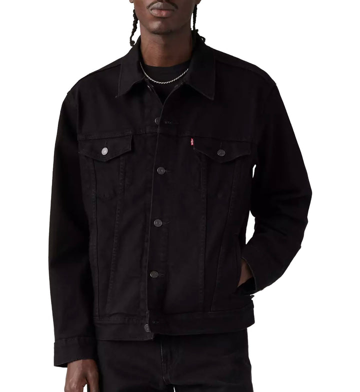 Person wearing a Levi’s Trucker Jacket — Last Night (Black) on a white background