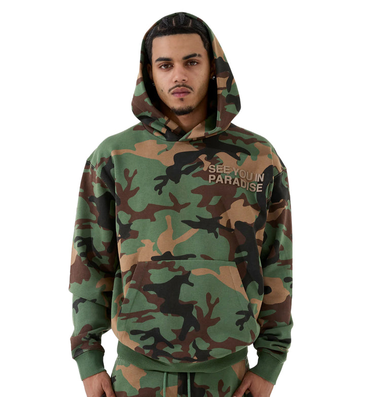 Man wearing See You In Paradises Tonal Pullover Hoodie — Vintage Camo