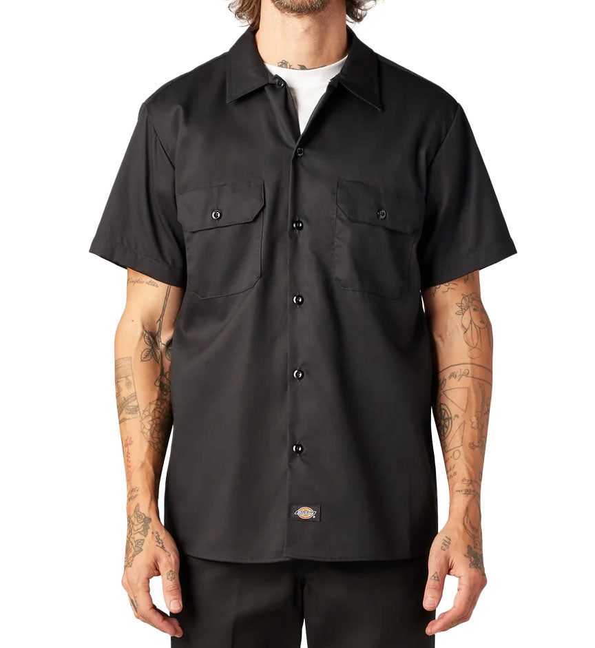 Man wearing black Dickies FLEX Slim Fit Short Sleeve Work Shirt against a white background
