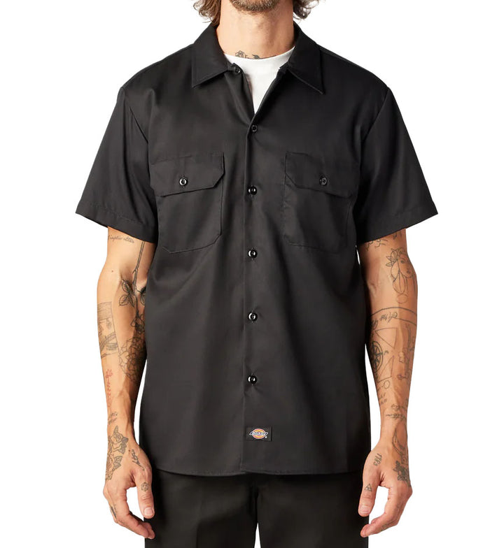 Man wearing black Dickies FLEX Slim Fit Short Sleeve Work Shirt against a white background