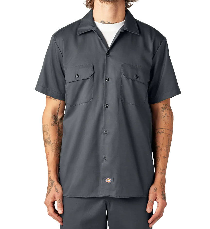 Man wearing charcoal Dickies FLEX Slim Fit Short Sleeve Work Shirt against a white background