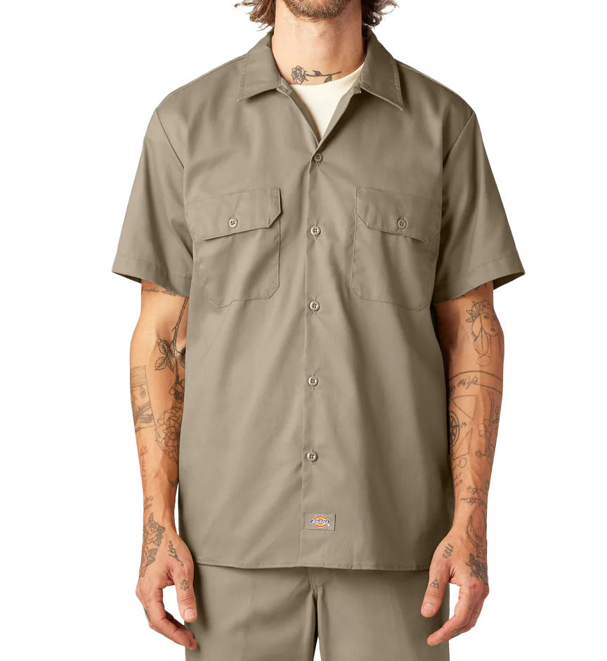 Man wearing a Dickies FLEX Slim Fit Short Sleeve Work Shirt in Desert Sand against a white background