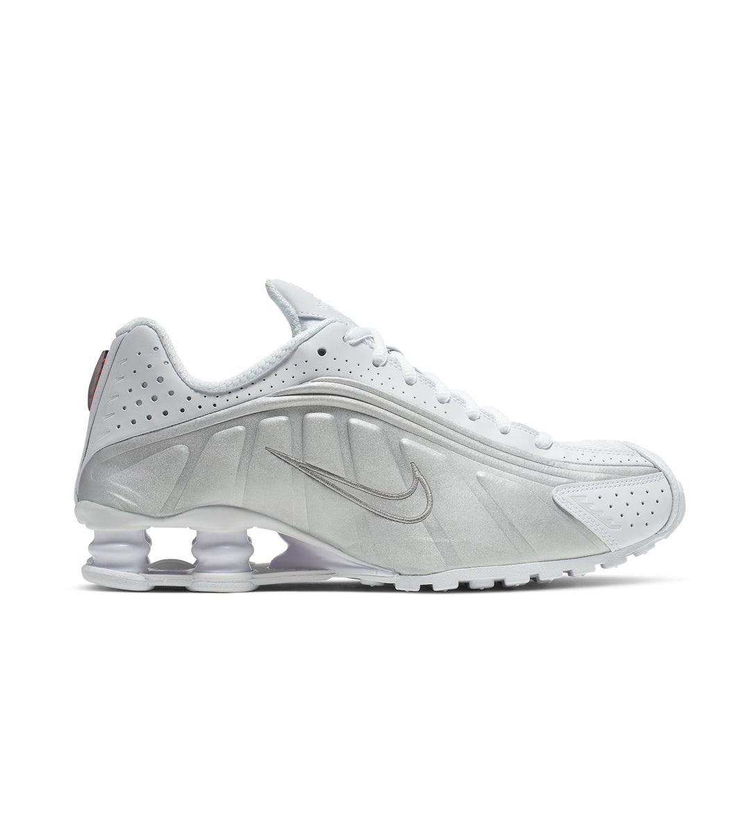 White and silver Nike Shox R4 Women's sneaker on a white background