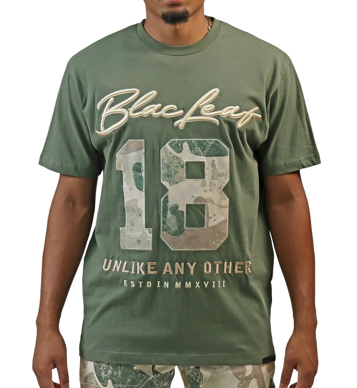 Person wearing Blac Leaf Purpose Above All T-Shirt “Military Olive”