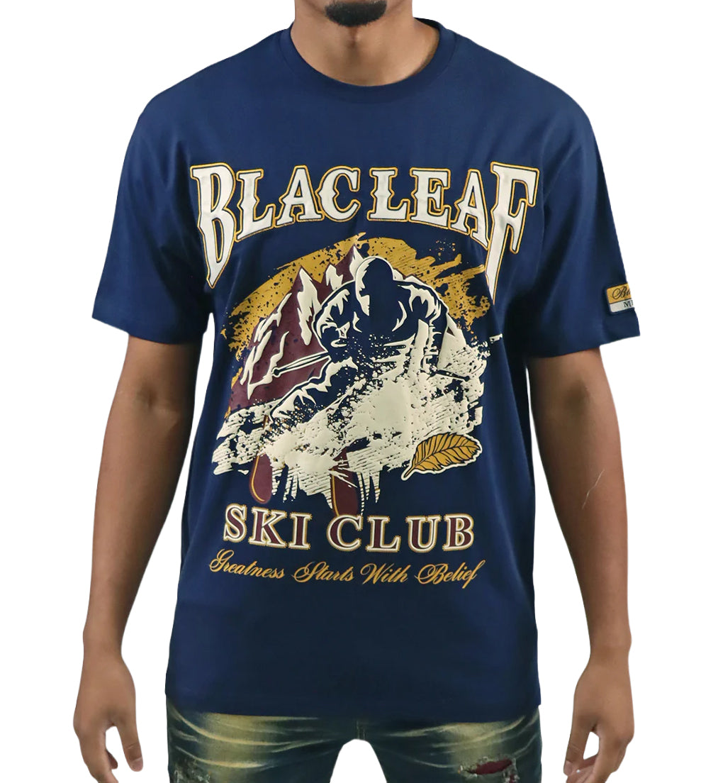 Person wearing Blac Leaf Greatness Starts With Belief T-Shirt “Navy”