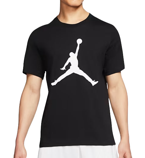 Black Jordan Jumpman T-Shirt with a white logo worn by a person on a white background