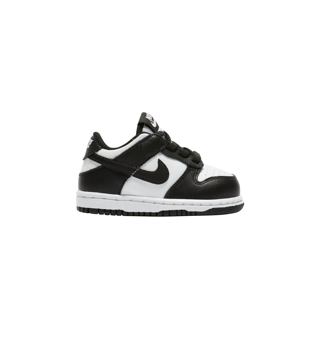 Black and white Nike Dunk toddler sneaker with Nike logo on a white background