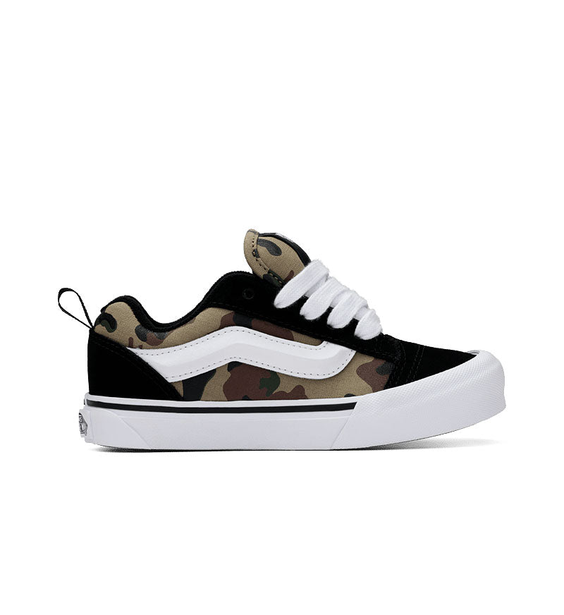 Camouflage-patterned sneaker with white accents on a white background