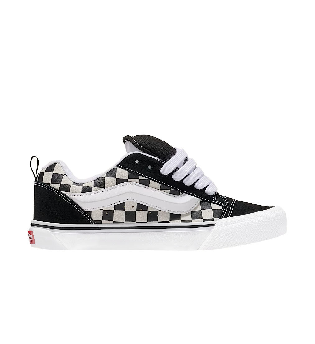 Black and white checkered sneaker on a white background