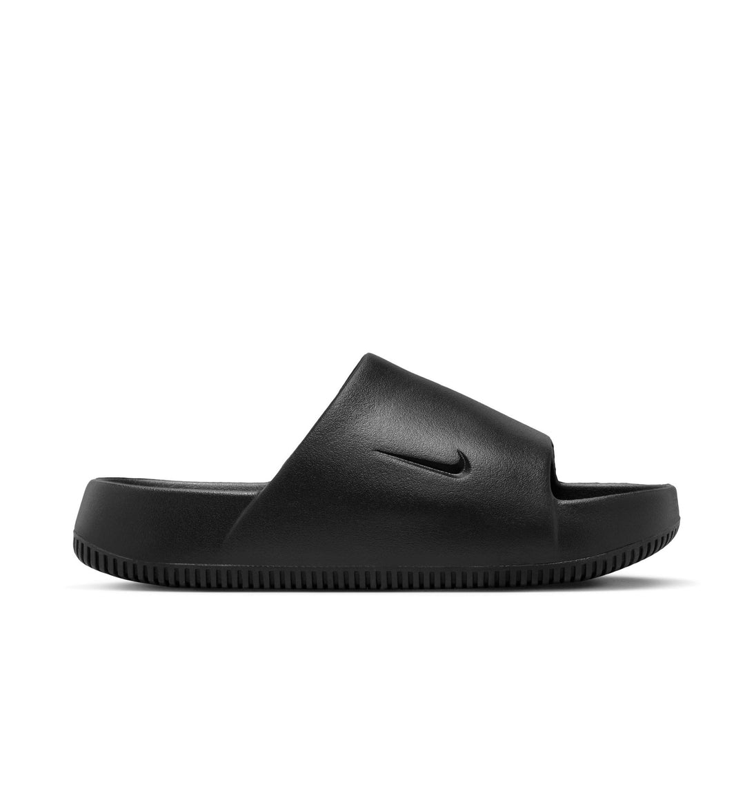 Black Nike Calm Women’s Slides with Nike logo on a white background