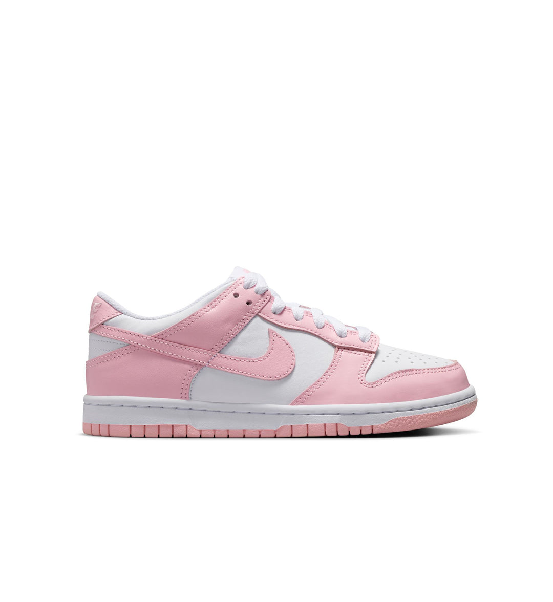 Pink and white Nike Dunk grade schoolbsneaker with Nike logo on a white background
