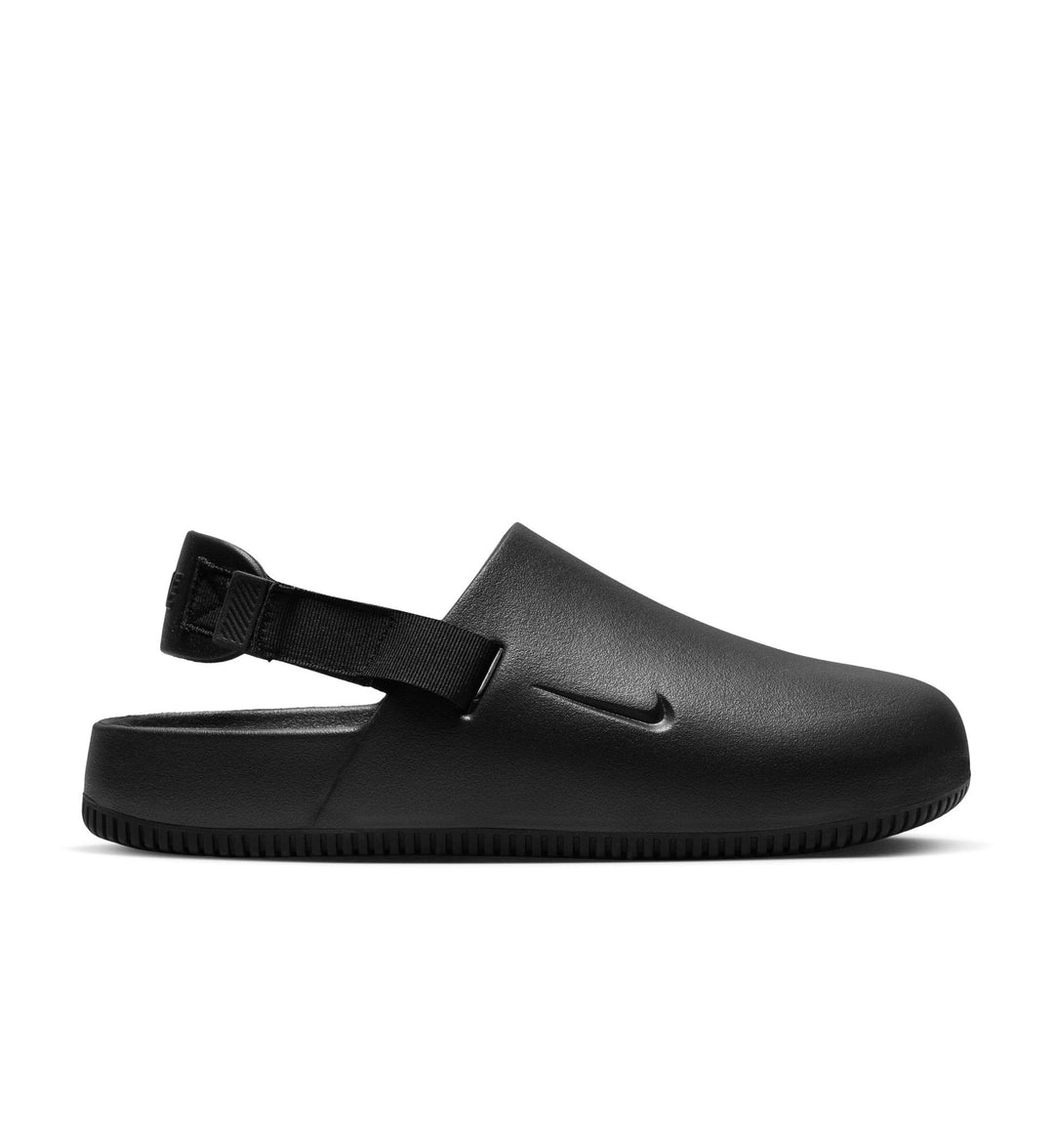 Black sandal with a strap on a white background