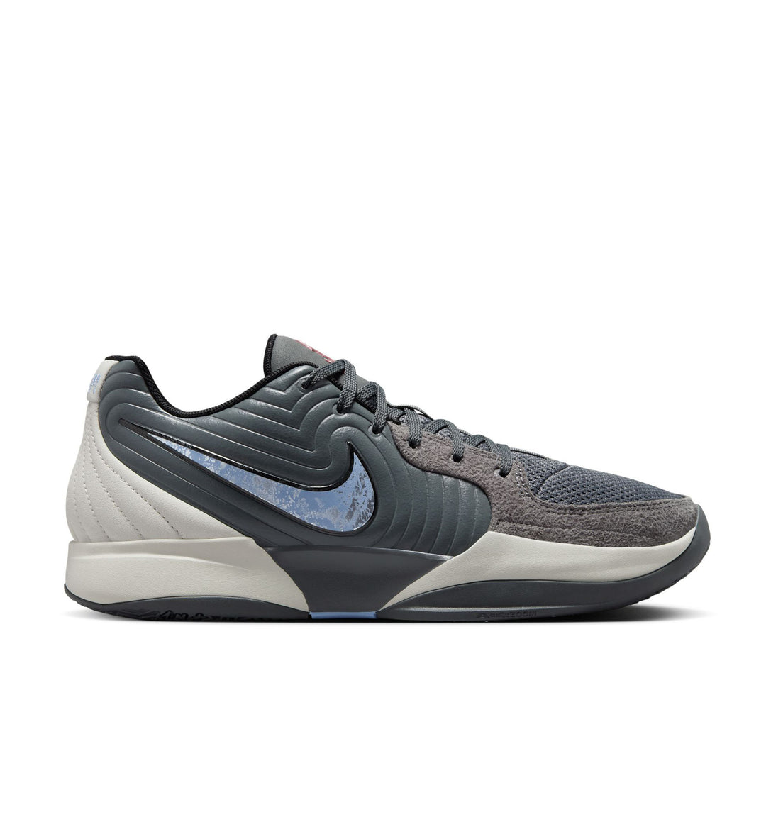 Gray low top basketball shoe with light blue Nike logo on a white background