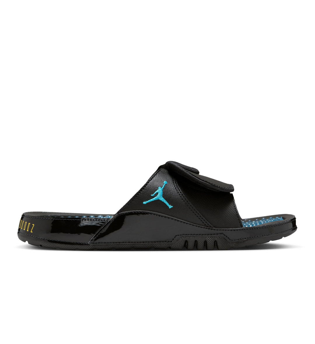 Side view of the black and Gamma Blue Jordan Hydro XI Slide on white background