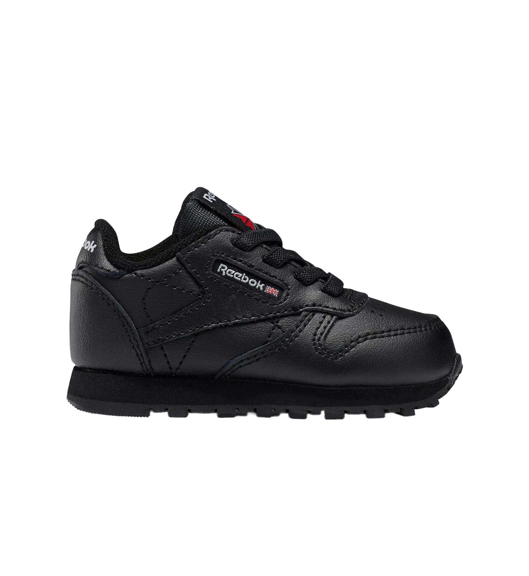 All black toddler Reebok Classic Leather shoe on white background.