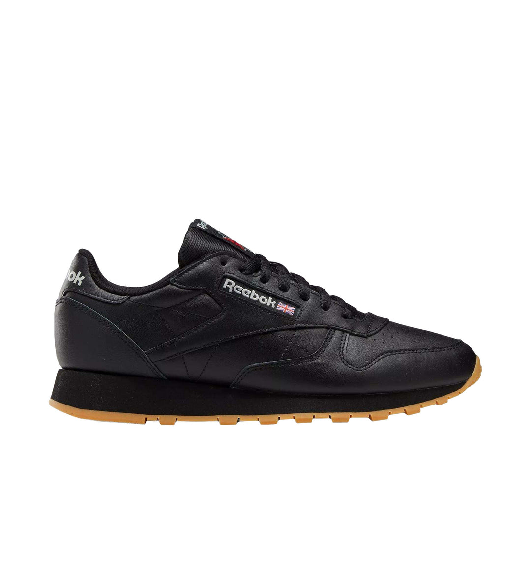 Black and gum sole Reebok Classic Leather shoe on white background.