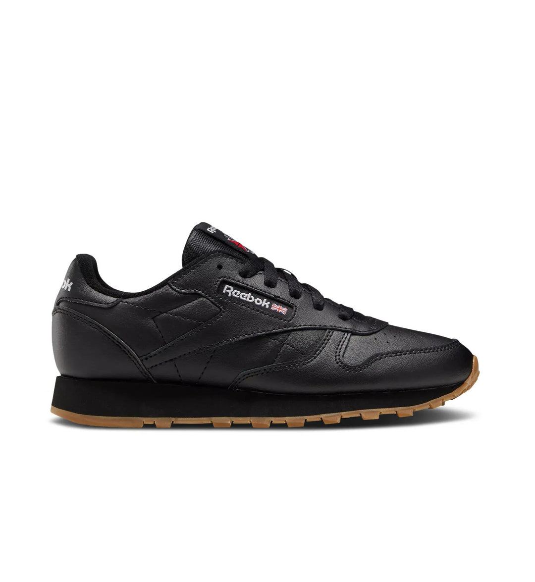Black and gum sole Reebok Classic Leather grade school on white background.