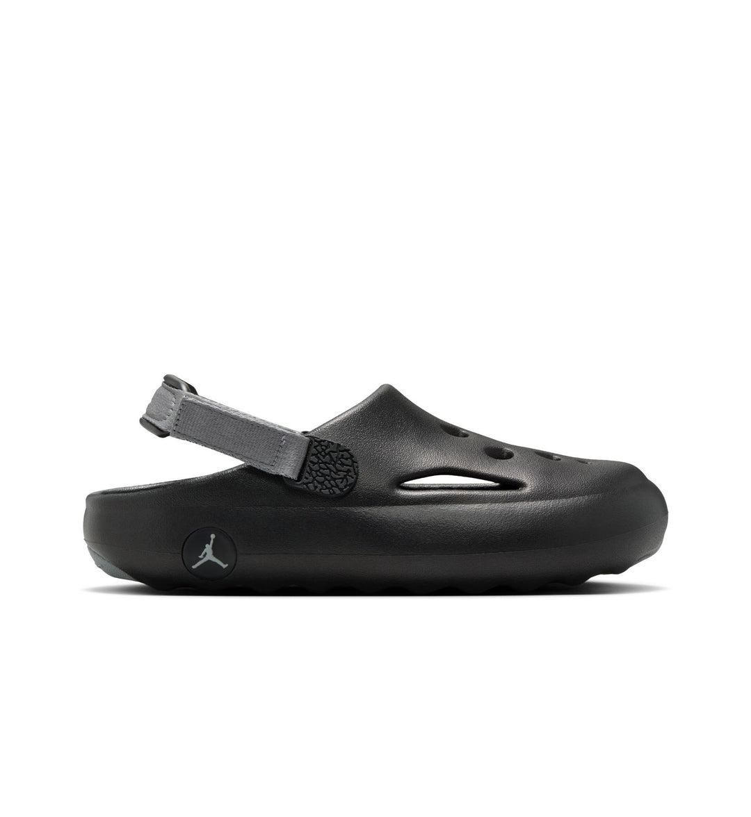Black sandal with a strap on a white background