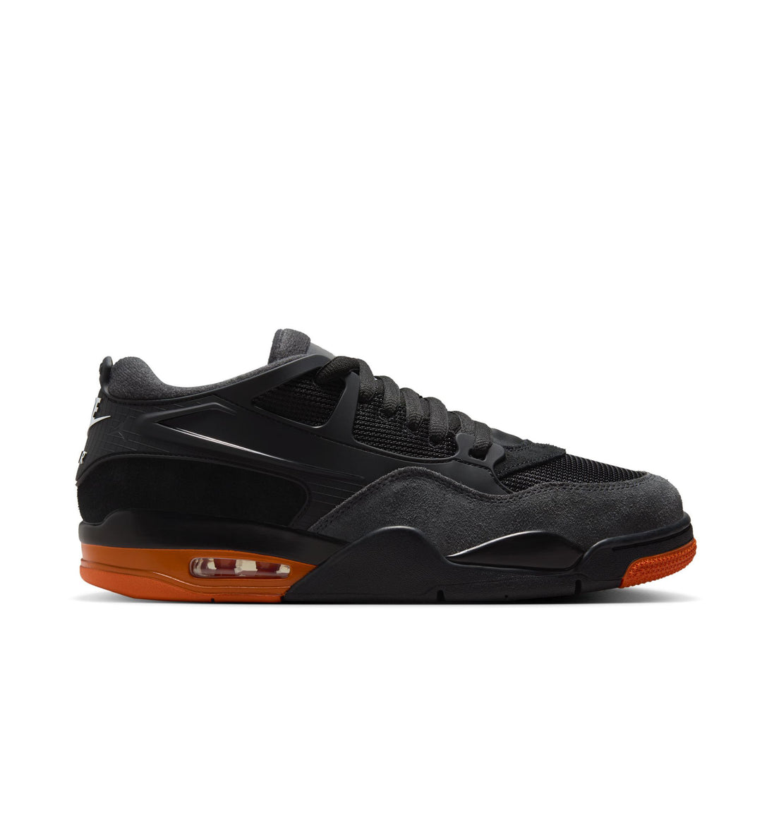 Black Jordan sneaker with orange accents on a white background