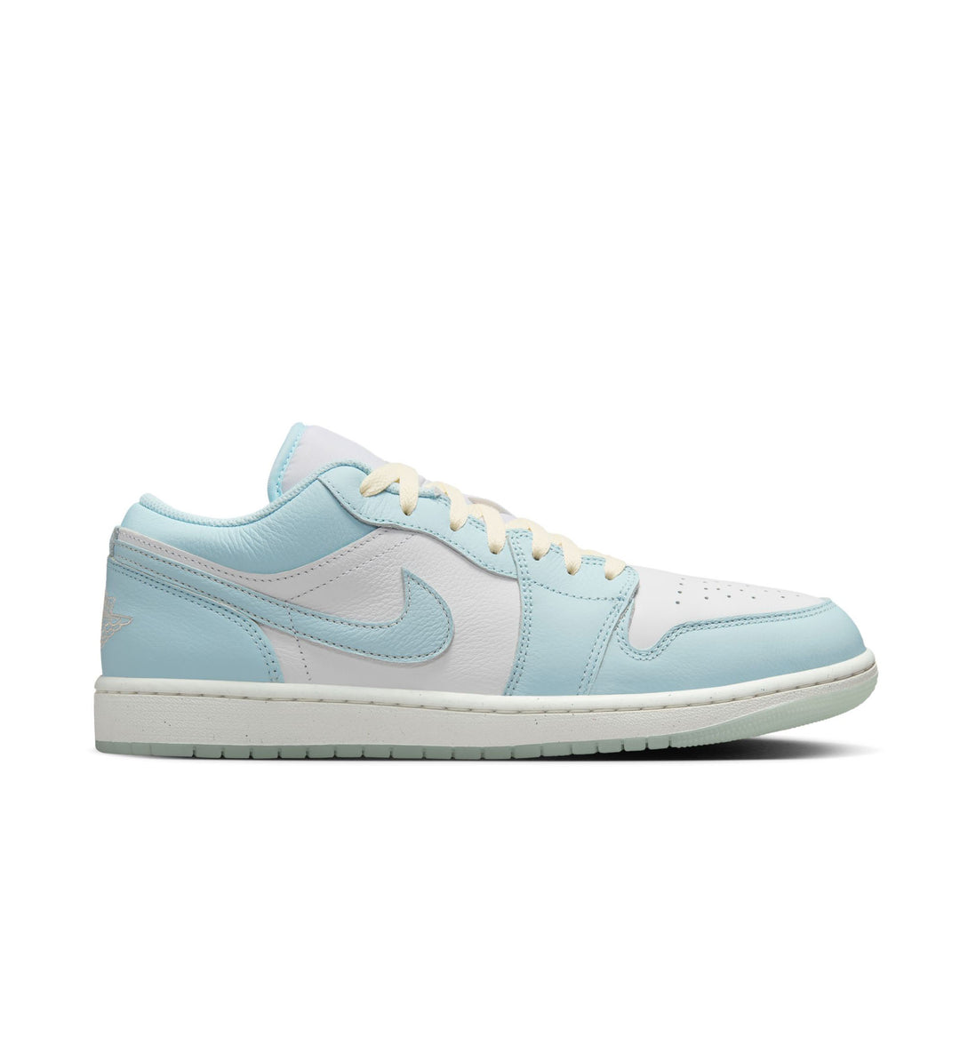 Light blue and white sneaker with a brand logo on a white background