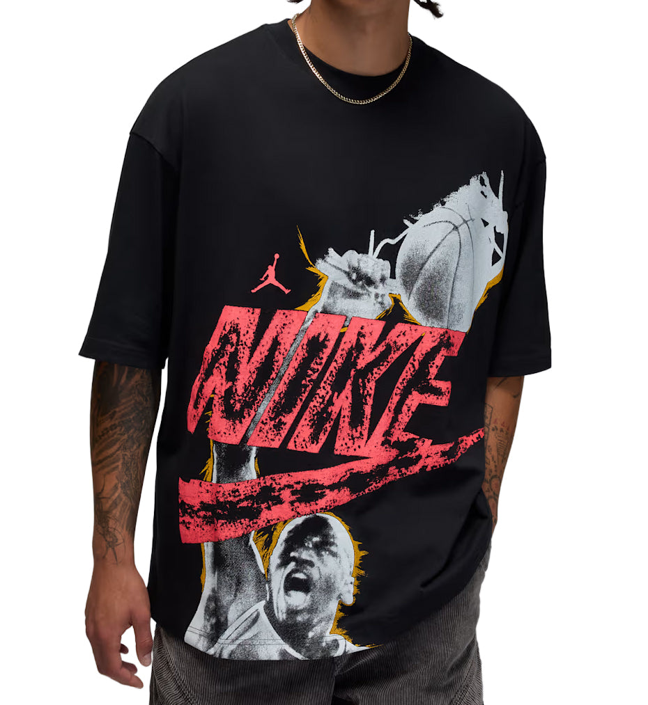 Person wearing a black Jordan Reissue Oversized t-shirt with Nike graphic design and text