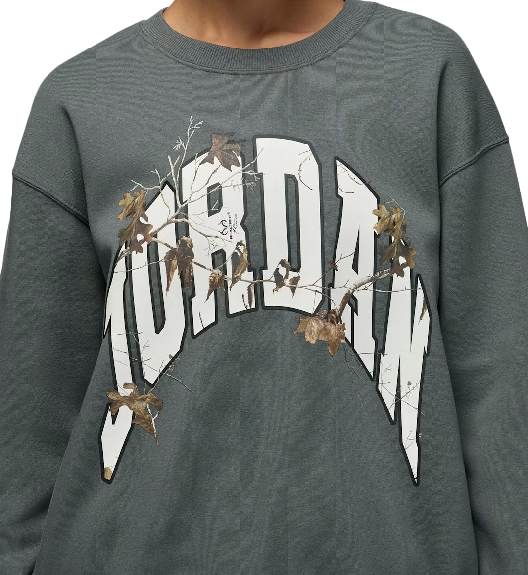 Gray Jordan Brooklyn Fleece Women’s Realtree Crew-Neck Sweatshirt with 'Jordan' graphic design on a plain background