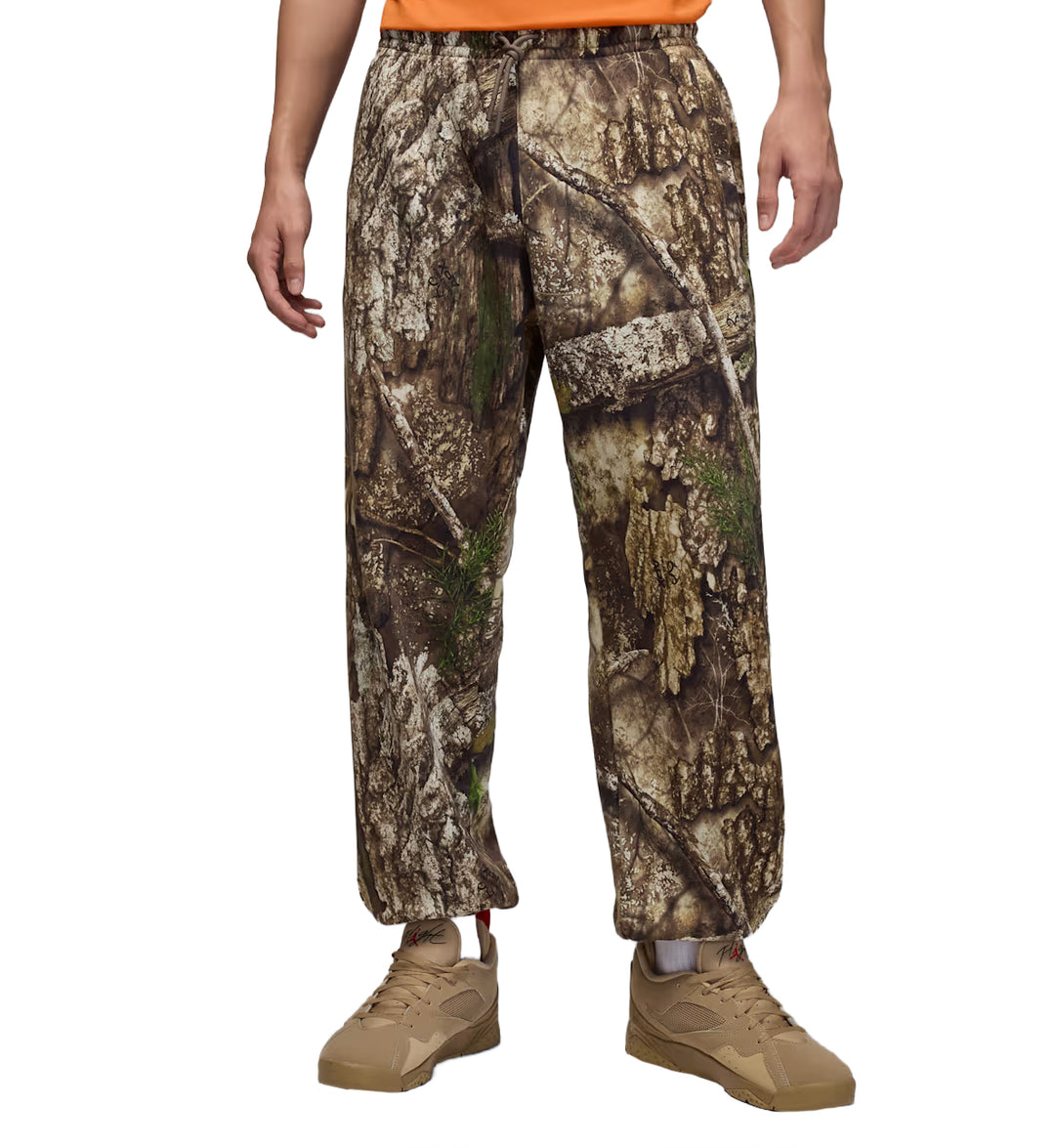 Jordan Brooklyn Fleece Realtree Pants worn by a person on a white background