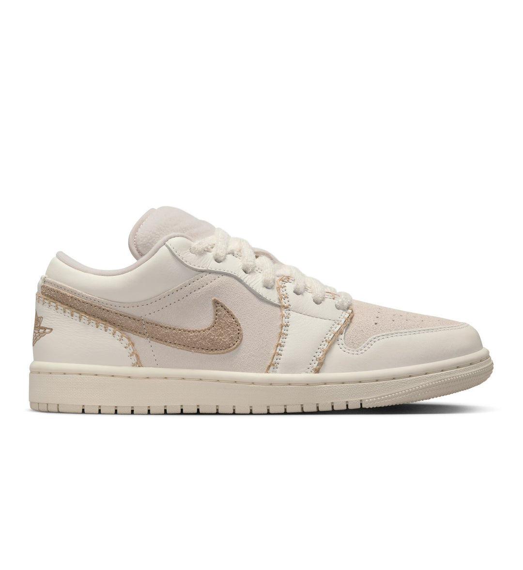 Cream and tan women's NikeAir Jordan 1 Low SE on white background