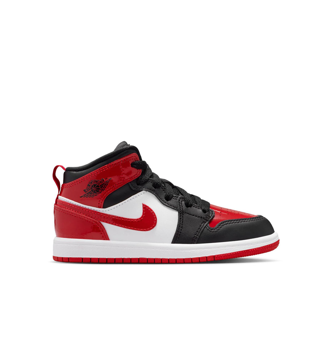 Red, black, and white Nike Air Jordan 1 Mid SE preschool shoe against a white background
