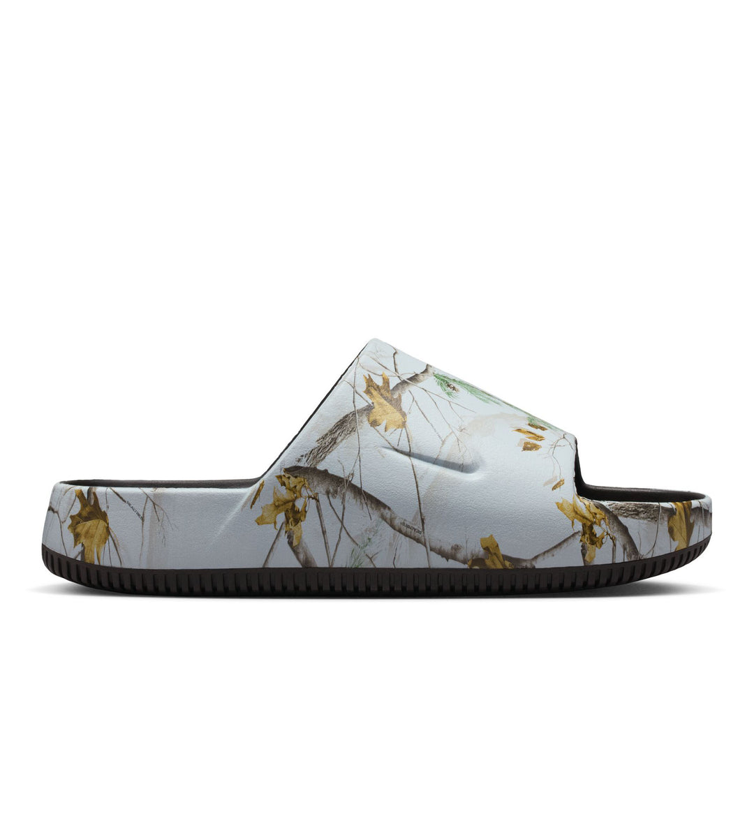 White and Realtree camo Nike Calm Slide shoe on a white background