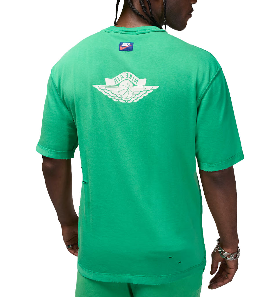 Green Jordan Rare Air T-shirt with a logo on the back worn by a person, on a white background