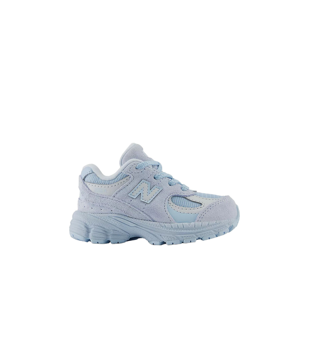 Light blue sneaker with New Balance logo on a white background
