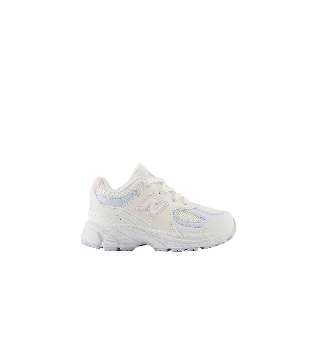 White sneaker with light blue accents on a white background