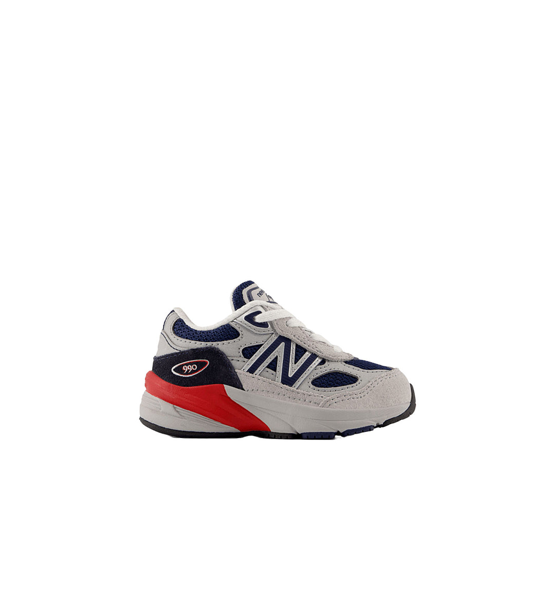 Gray sneaker with red and blue accents on a white background