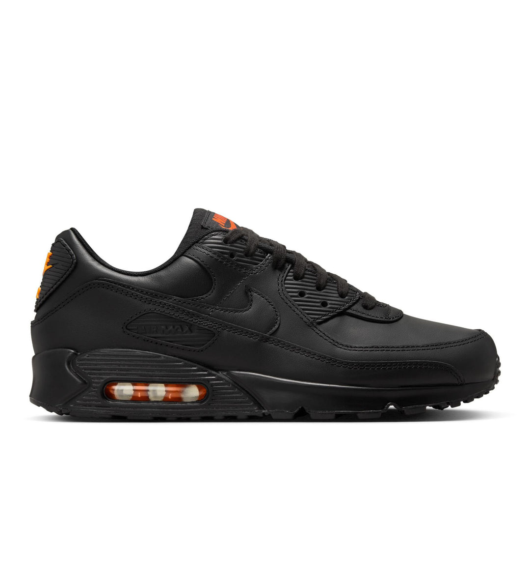 Black with orange accents Nike Air Max 90 shoe on white background