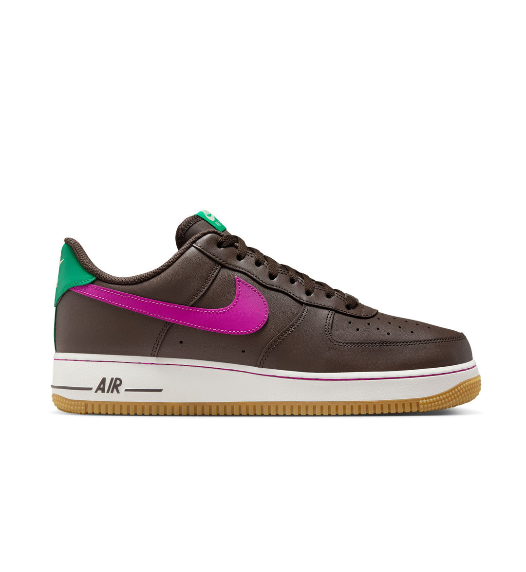 Brown sneaker with pink swoosh logo on a white background
