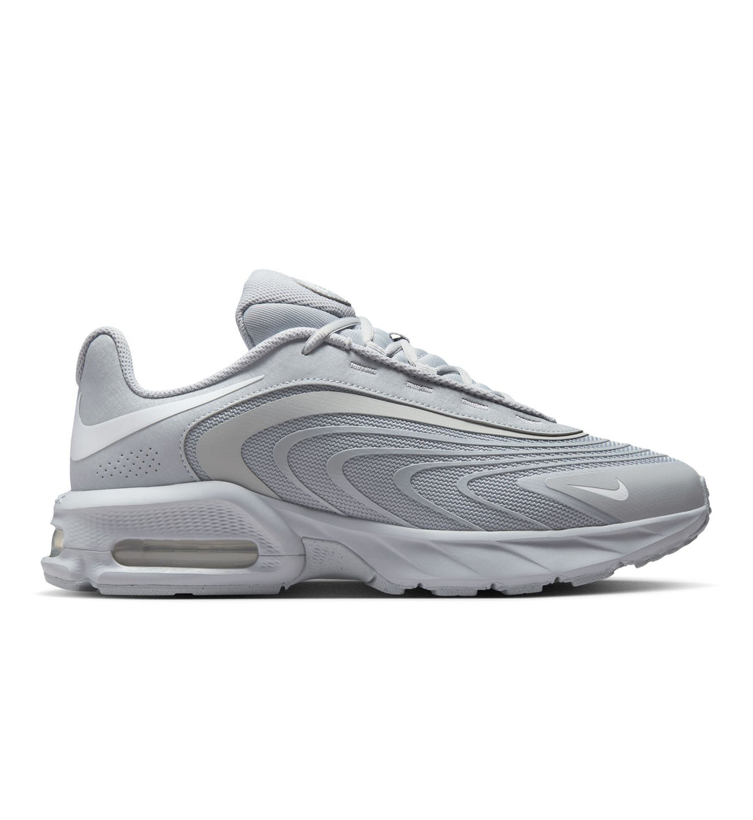 Gray and white Nike Air Max Fire on white background