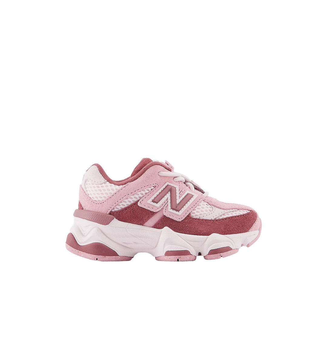 Toddler pink and white New Balance 9060 on white background