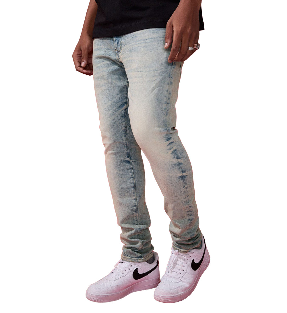 Person wearing Jordan Craig Slim Taper Fit – Alexander Pure Denim — Cream Wash