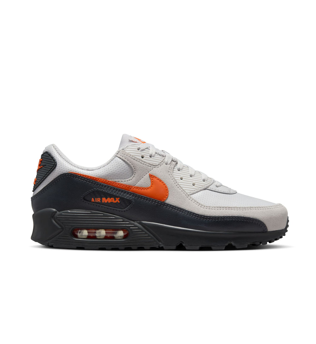 Light Grey and Dark Grey Nike Air Max 90 sneaker with orange accents on a white background