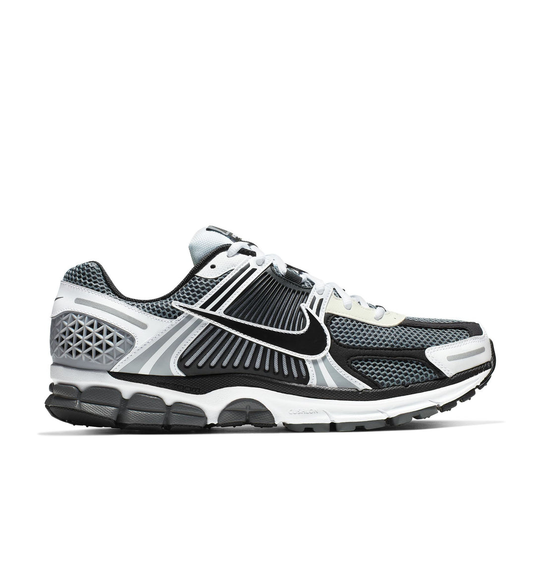 Black and gray athletic running shoe Nike Zoom Vomero 5 on a white background