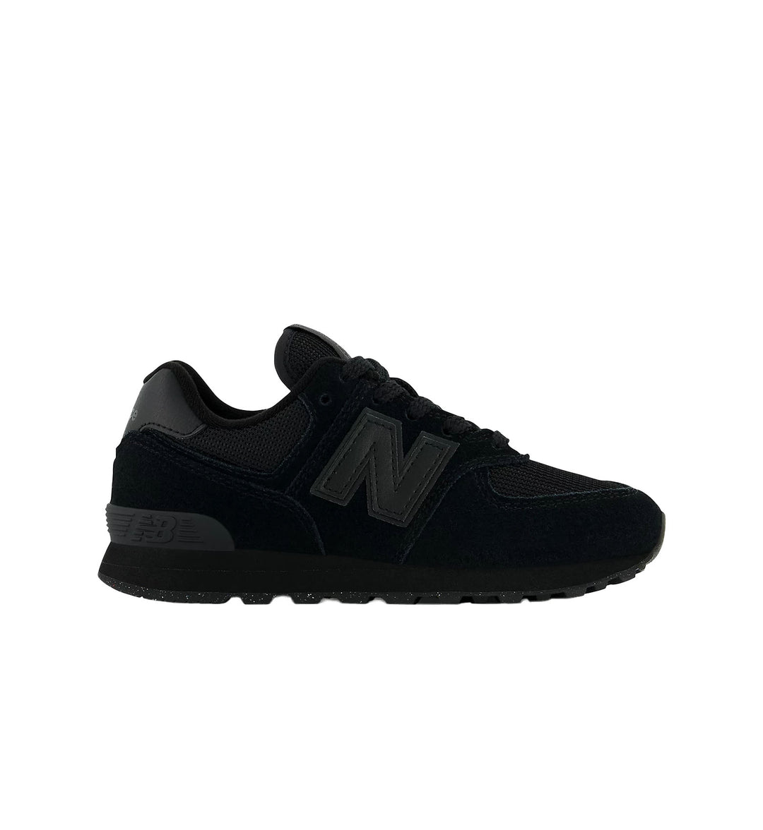 Black New Balance preschool 574 shoe with white background.