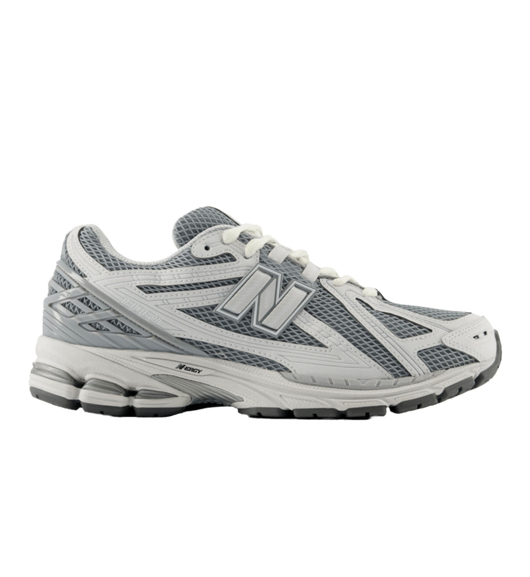 Gray and white running shoe on a white background