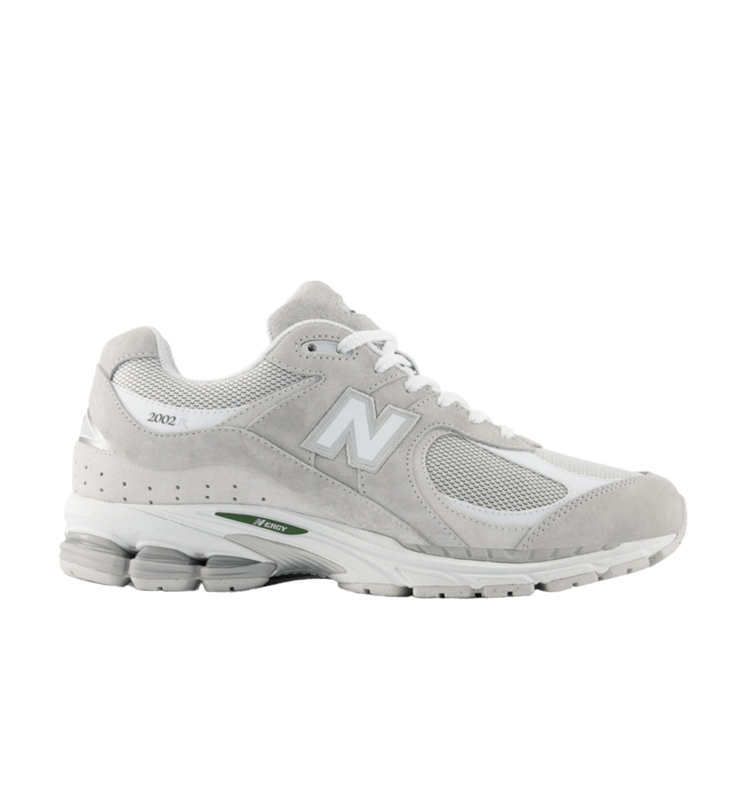 Gray athletic shoe with New Balance logo on a white background