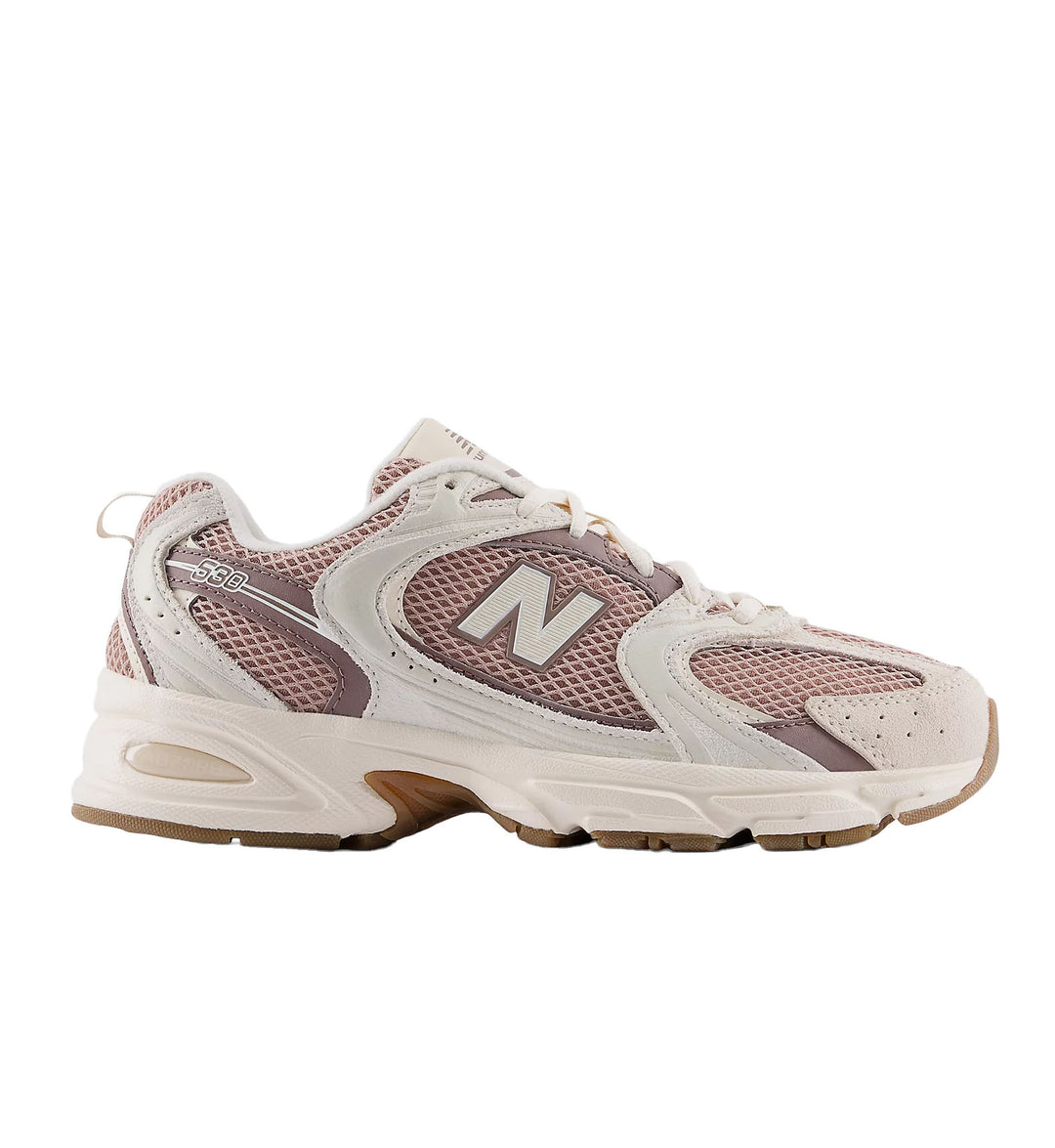Pink and white sneaker with New Balance 530 logo on a white background