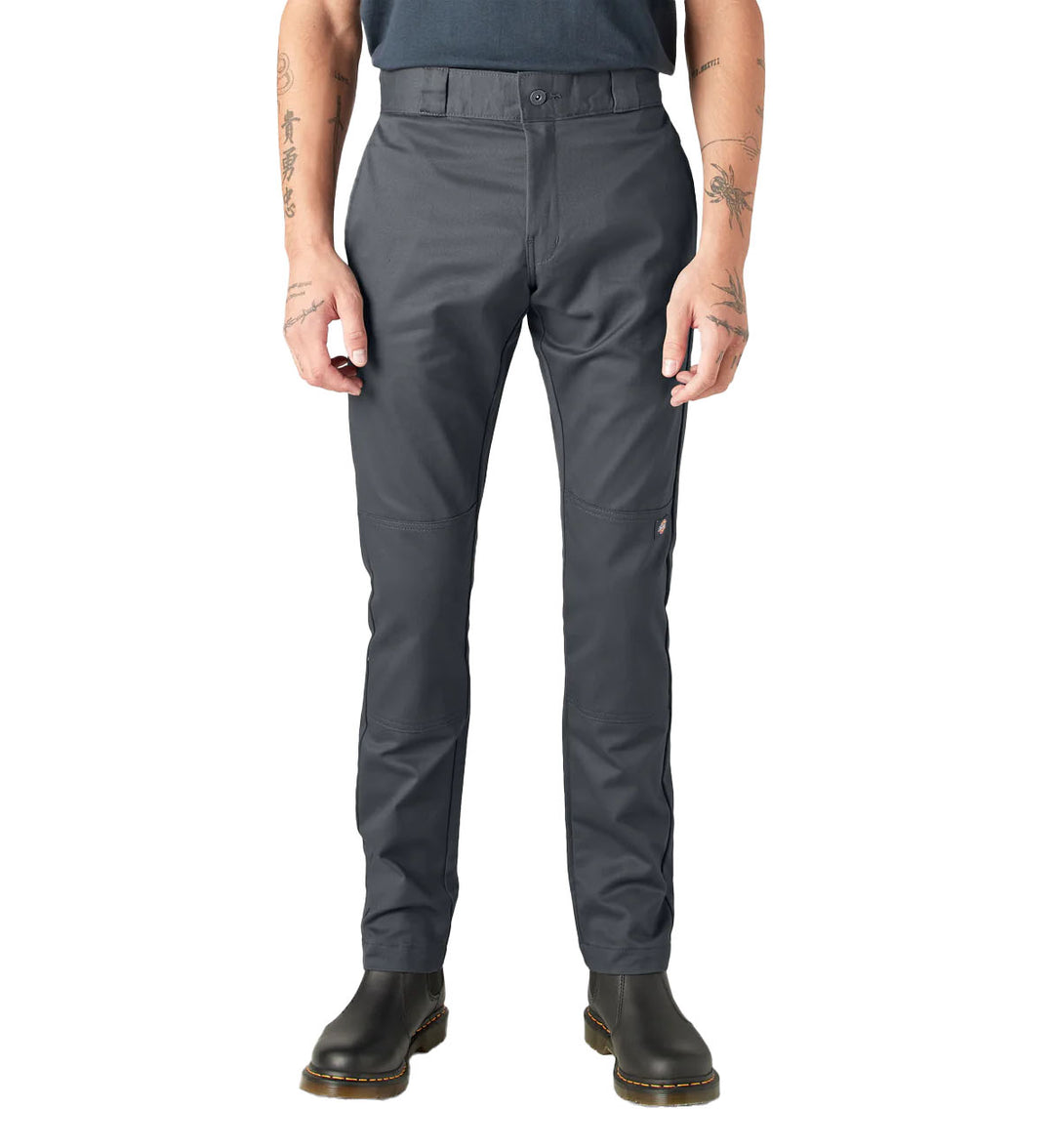 Person wearing charcoal gray Dickies FLEX Skinny Fit Double Knee Work Pants on a white background