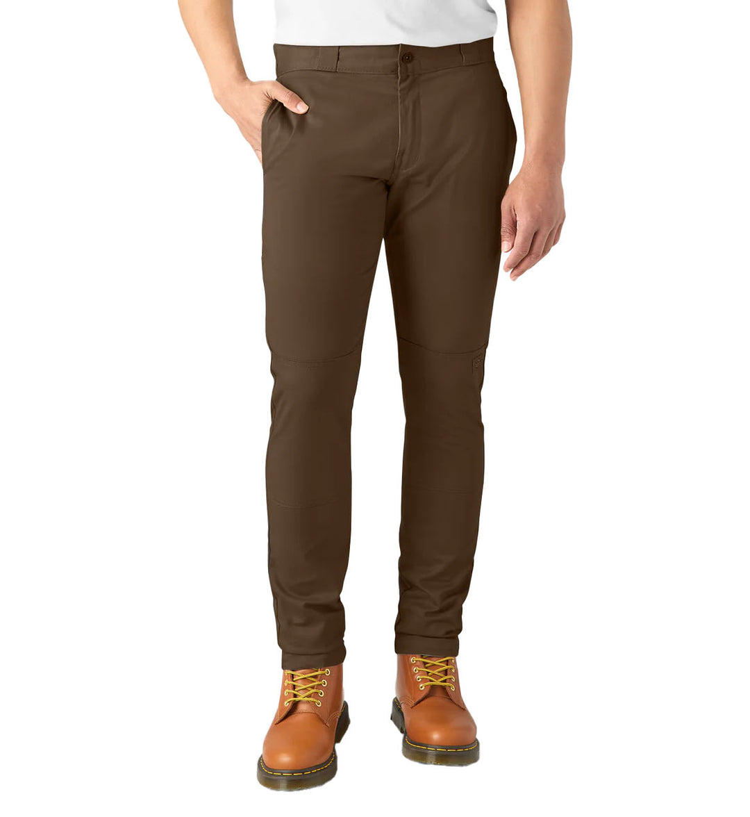Brown Dickies FLEX Skinny Fit Double Knee Work Pants worn by a person on a white background