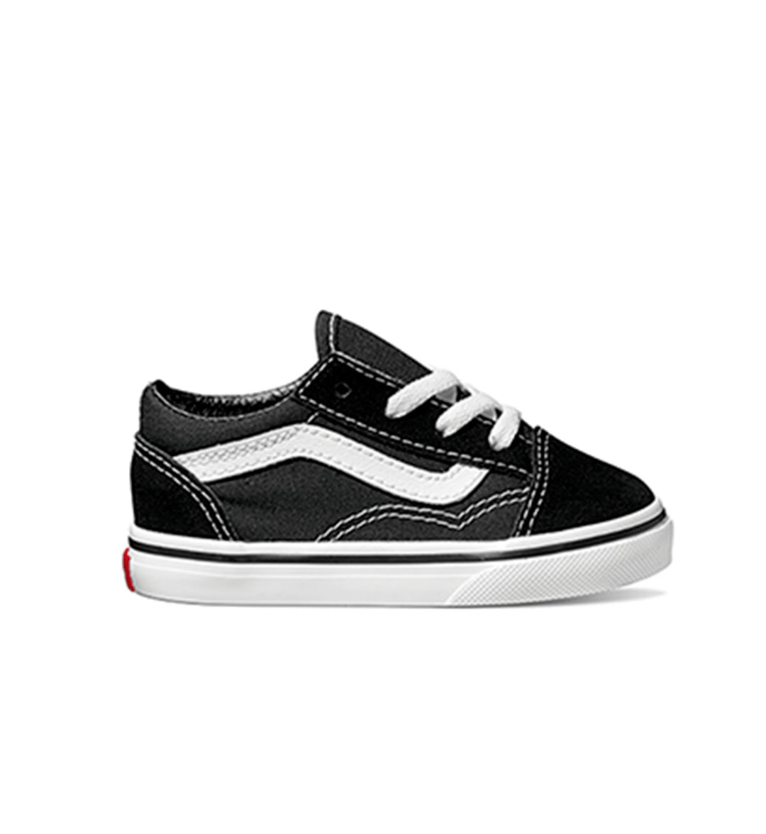 A black and white Vans Old Skool sneaker with a sidestripe and classic waffle outsole, designed for toddlers.